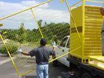 loading steel pallets onto truck